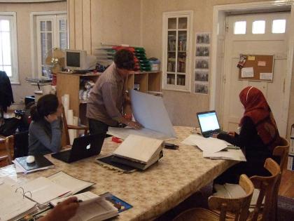 Freya Sadarangani, James Taylor, and Hanan Mahmoud do post-ex work.