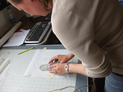 Amy McMahon digitizes hand-drawn site maps for GIS.